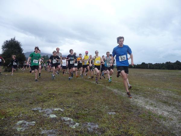 First across the line, Lorenz Kissling, (No 82) leading the field on the Hawea River Track for Race 1 Kathmandu Riverrun Trail Series, Lake Wanaka